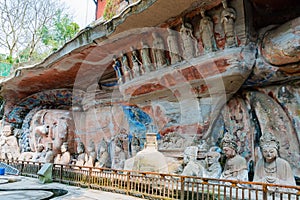 Rock carving of Sakyamuni Buddha entering Nirvana, with his disciples photo