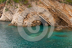 Rock cave on coastaline. Summer beauty of adriatic seaside nature