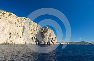 Rock and cliff in blue sea