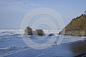 The rock cliff on the cold coastline