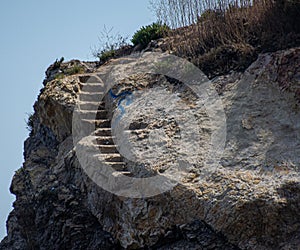 Rock cliff stairway going nowhere