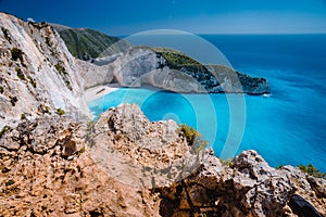 Rock Cliffs in front of Navagio beach Zakynthos. Shipwreck bay with turquoise water and white sand beach. Famous marvel