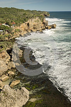 Rock clifs of insonesian seashore near the beach Ngobaran