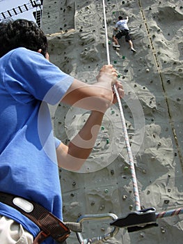 Rock climber and belayer