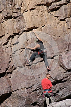 Rock climber with belayer