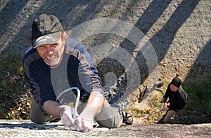 Rock climber on cliff face