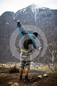 A rock climber climbing on a boulder rock outdoors