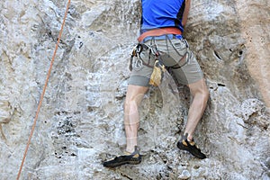 Rock climber climbing on the cliff