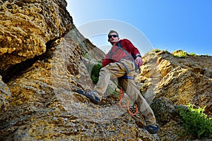 Rock-climber climbing on rock