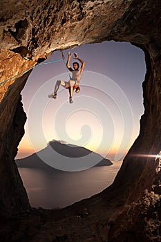 Rock climber falling a cliff while lead climbing
