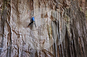 Rock climber in a famouse Bulgarian Cave Prohodna.