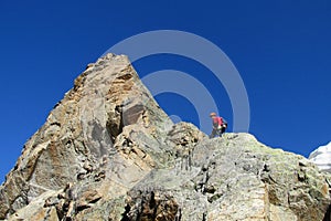 Rock climber on mountain top