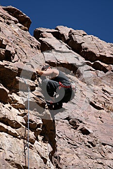Rock climber nearing top