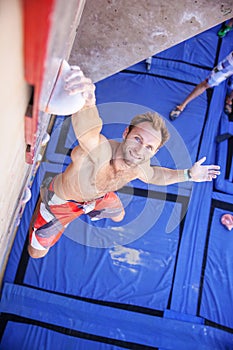 Rock climber participating in climbing competition