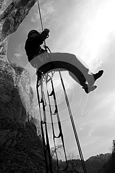 Rock climber rappeling photo