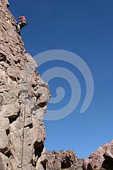 Rock climber rappeling