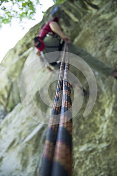 Rock climber rappelling photo