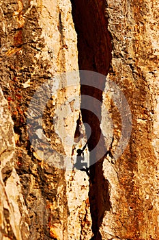 Rock climber in a rock chimney