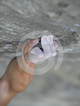 Rock climber's hand on handhold