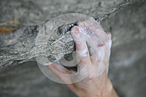 Rock climber's hand on handhold