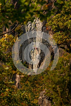 Rock climbers. Active lifestyle, risky hobbies, dangerous adrenaline sports background. Group of friends climbing Hradok.