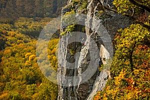 Rock climbers. Active lifestyle, risky hobbies, dangerous adrenaline sports background. Group of friends climbing Hradok.