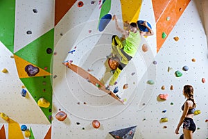 Rock climbers in climbing gym.