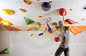 Rock climbers in climbing gym.