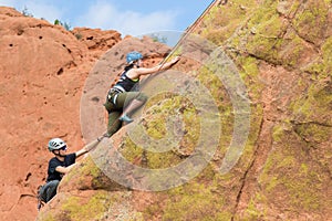 Rock climbers in Colorado Garden of the Gods on vertical climb