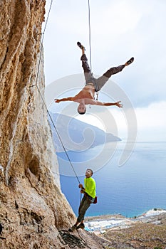 Rock climbers fooling around photo