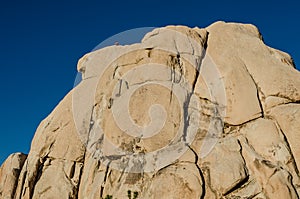 Rock Climbers on Large Boulder