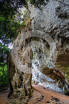 Rock climbing on challenging climbing route with stalactite in Thailand Ton Sai