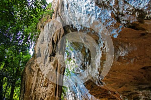 Rock climbing on challenging climbing route with stalactite in Thailand Ton Sai