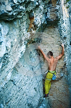 Rock climbing. man rock climber climbing the challenging route on the limestone wall