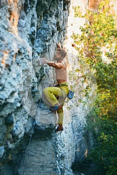 Rock climbing. man rock climber climbing the challenging route on the limestone wall