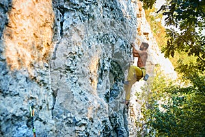 Rock climbing. man rock climber climbing the challenging route on the limestone wall