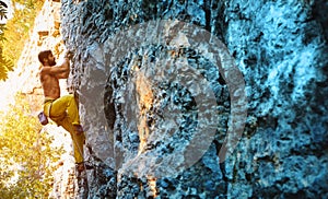 Rock climbing. man rock climber climbing the challenging route on the limestone wall