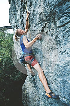 Rock climbing. man rock climber climbing the challenging route on the limestone wall