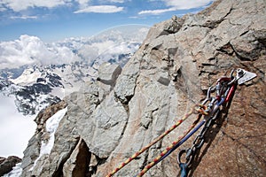 Rock With Climbing Rope in Foreground and the Alps in Background