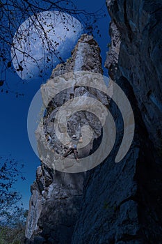 rock climbing on the rock whit moon in sky