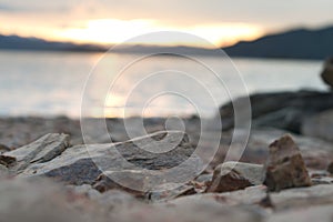 Rocks on a beach at sunset