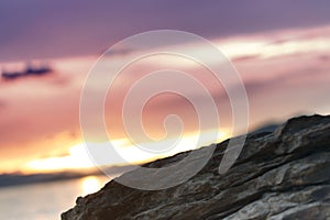 Rocks on a beach at sunset