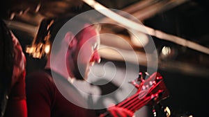 Rock concert. Two guitarists play their parts at the concert and headbanging