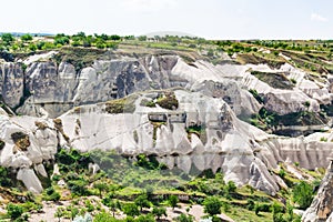 rock-cut houses on mountaion slope in Goreme