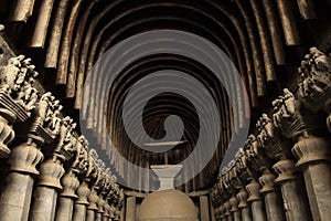 Rock cut stupa with only surviving wooden umbrella in western Indian rock-cut Karla caves, Pune district, Maharashtra India