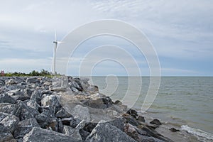 Rock dam prevents erosion from the waves hitting Pak Phanang beach