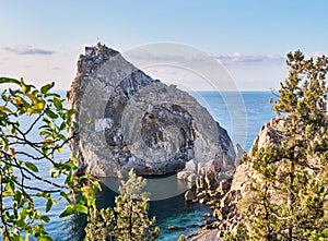 Rock Diva, the black sea coast near Yalta, Crimea. People walk on the suspension bridge, climb to the top, relax on the