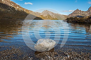 Rock on the edge of Dove lake in Cradle mountain national park, UNESCO world heritage sites of Tasmania state of Australia.