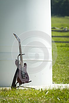 Rock eletric guitar standing in its carrier