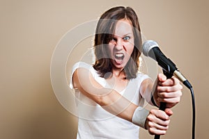 Rock female vocalist on gray background